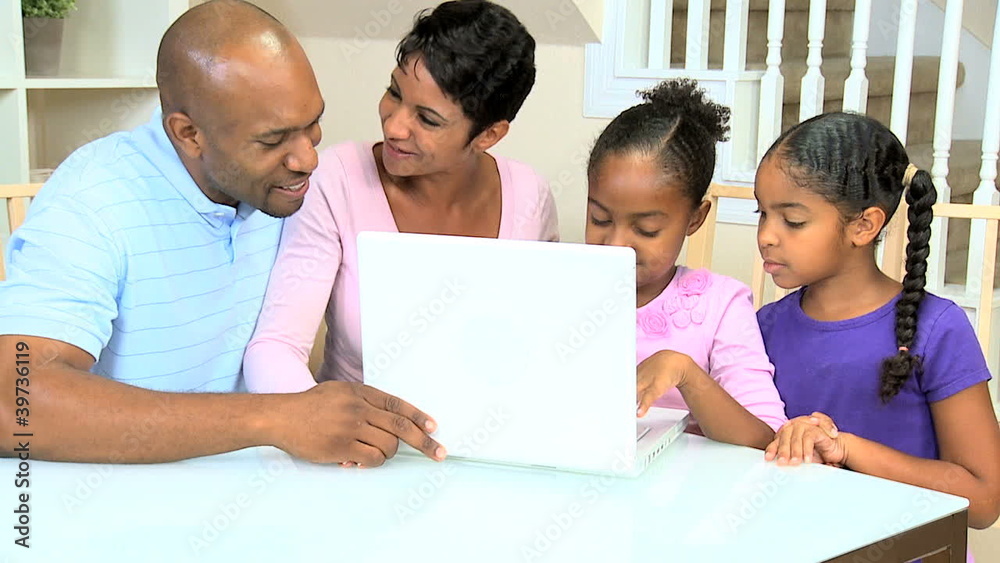 Little Ethnic Girls Using Laptop Computer with Parents Little Ethnic Girls Using Laptop Computer with Parents