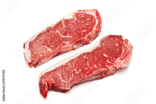 Sirloin steaks (beef) isolated on a white studio background.