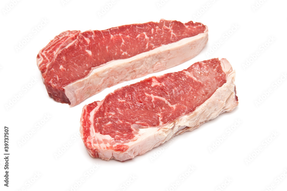 Sirloin steaks (beef) on a white studio background. Sirloin steaks (beef) on a white studio background.