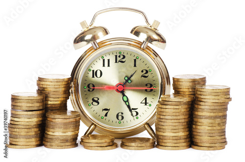 Alarm clock and money isolated on white background