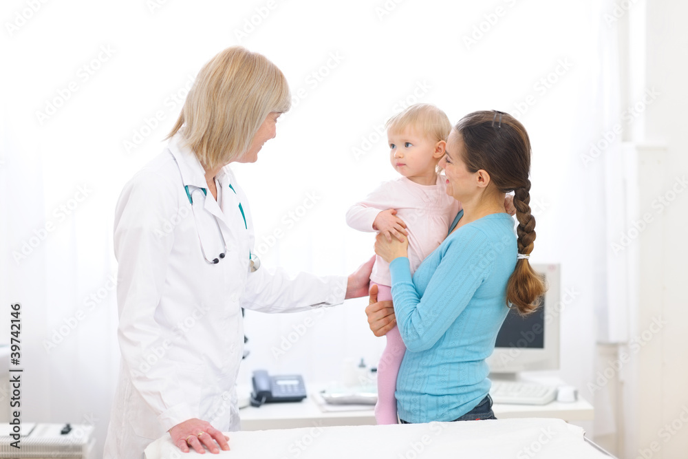 Young mother with baby visiting pediatric doctor Young mother with baby visiting pediatric doctor