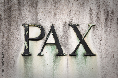 pax scritta su una pietra photo