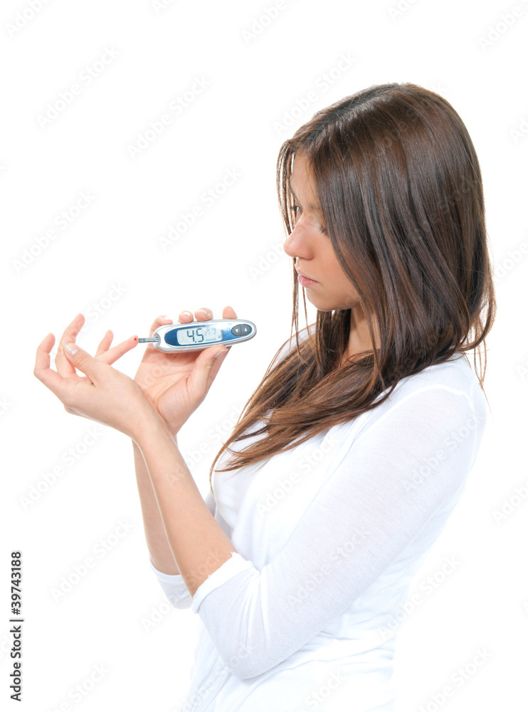 Woman measuring glucose level blood test Woman measuring glucose level blood test