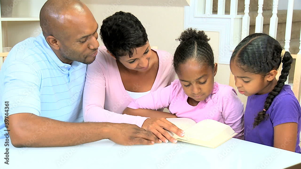 Young Ethnic Child Reading Aloud to Family