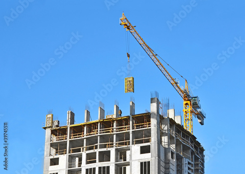 Valokuva Crane with concrete formwork at construction site