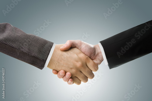 Business Handshake on gray background