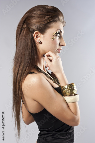 Young brunette lady with luxury accessories