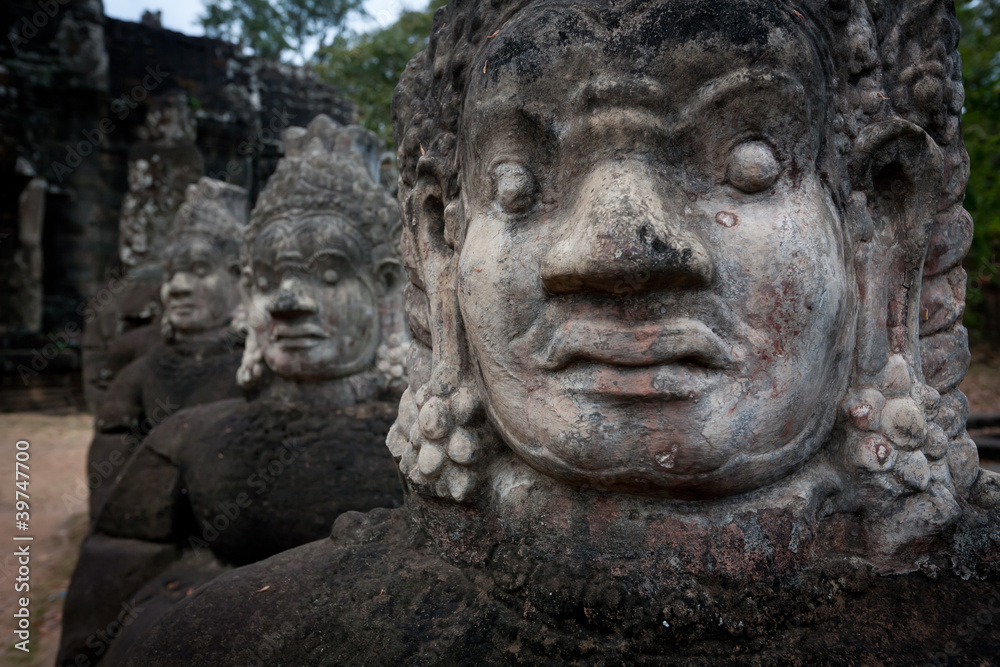 Face of Demon statues at Angkor temple Face of Demon statues at Angkor temple