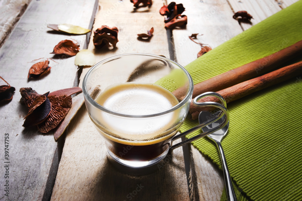 Fototapeta premium A cup of coffee on wood background