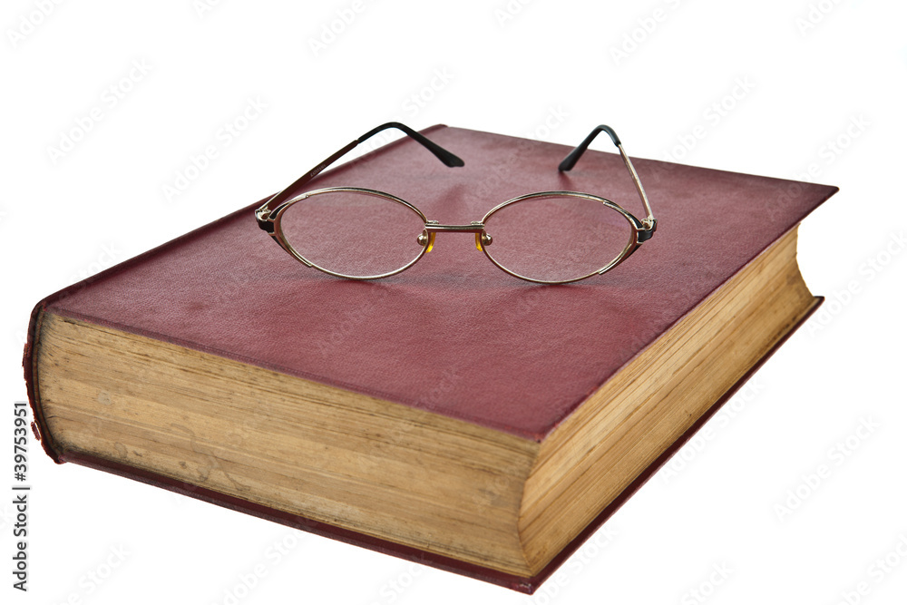 Old books with eye glasses isolated on white background Old books with eye glasses isolated on white background