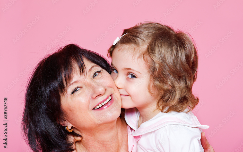 Senior woman and little girl Senior woman and little girl