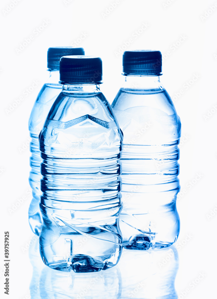 purified spring mineral water in the bottles with reflection purified spring mineral water in the bottles with reflection