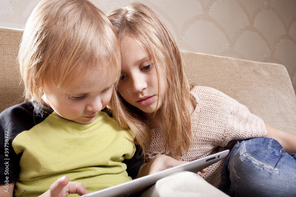 girl and boy with tablet computer girl and boy with tablet computer