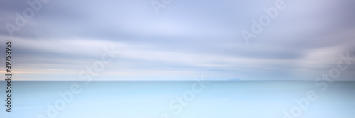 Long exposure photography panorama 3:1 with soft sea and cloudy