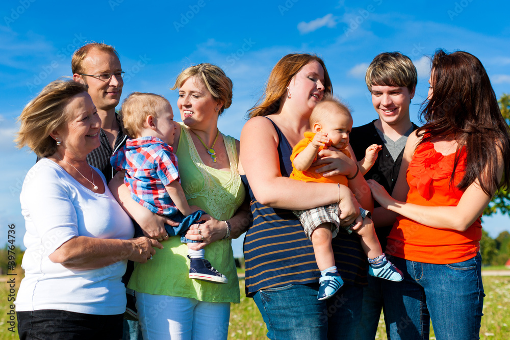 Obraz premium Family and multi-generation - fun on meadow in summer