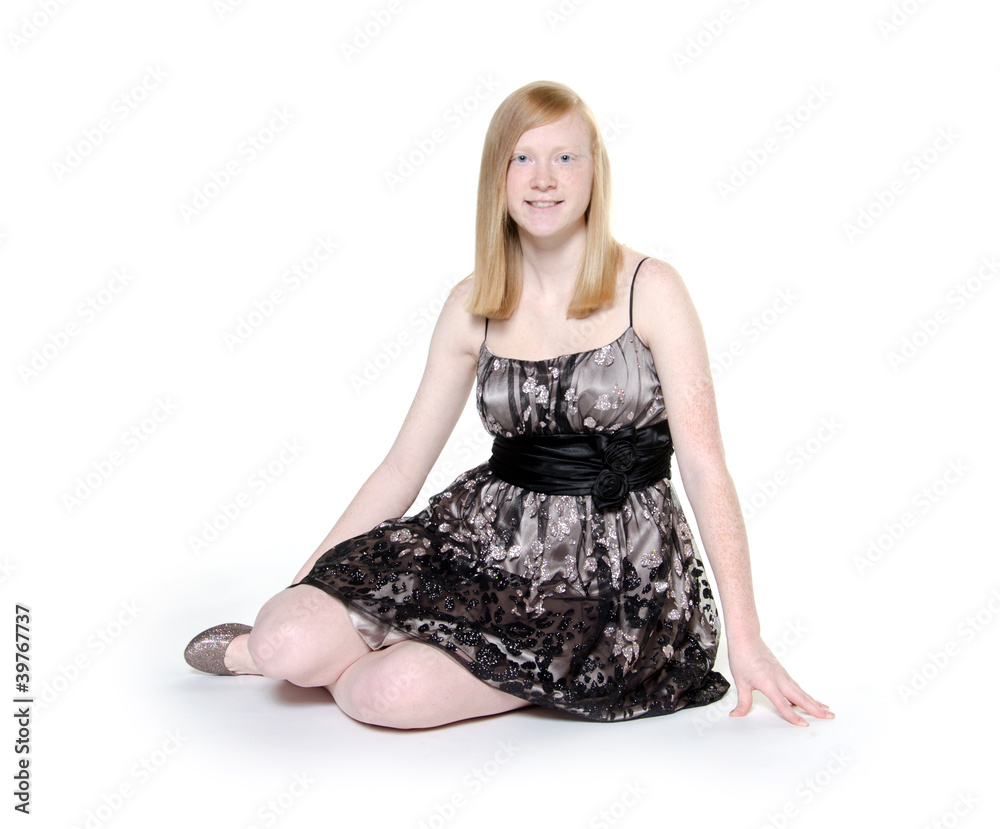 Naklejka premium Cute blond teen girl on white background