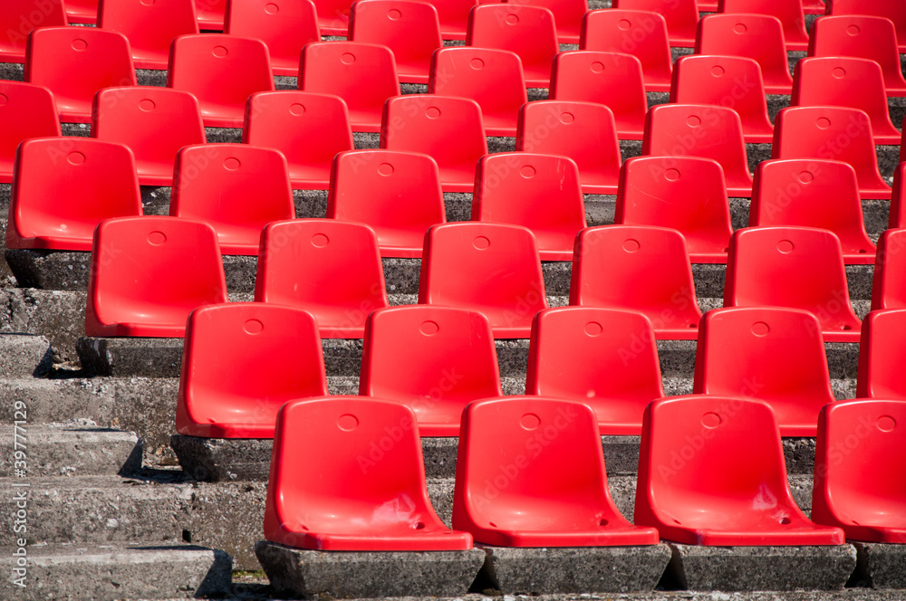 Naklejka premium Red stadium seats on the stand