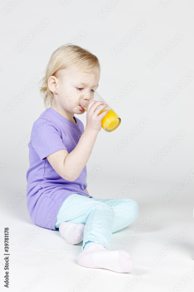 little girl drinking orange juice little girl drinking orange juice