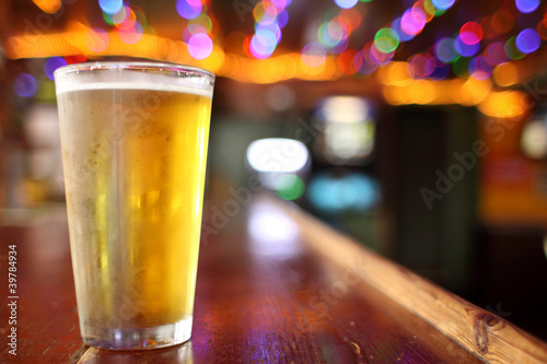 Beer on the counter at a bar.