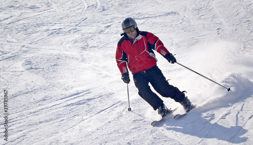 man down the slope on skis