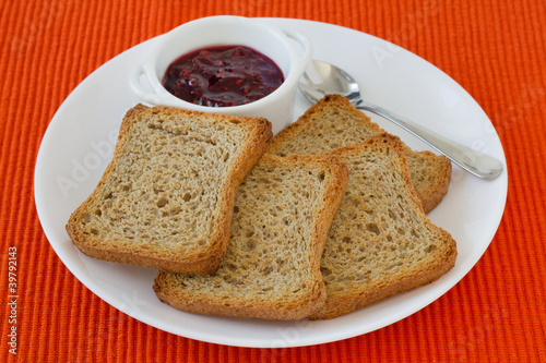 toasts with jam on the plate