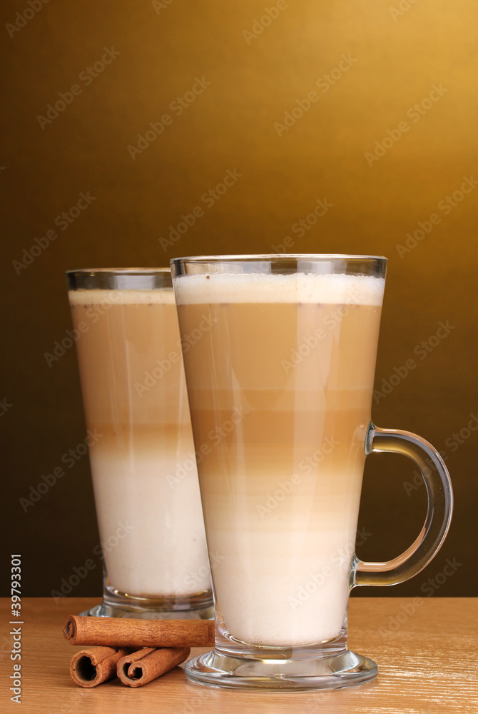 Fragrant сoffee latte in glass cup and cinnamon Fragrant сoffee latte in glass cup and cinnamon
