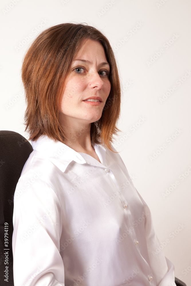 brunette in white blouse looking at cmaera brunette in white blouse looking at cmaera