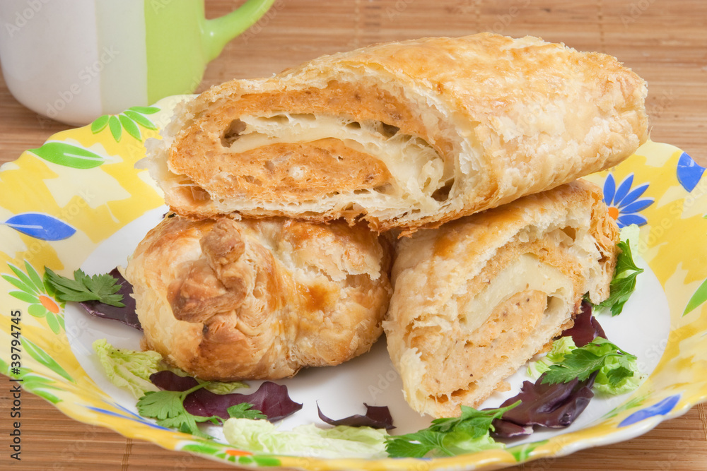 pie with fish mince filling, roll of puff pastry on plate pie with fish mince filling, roll of puff pastry on plate