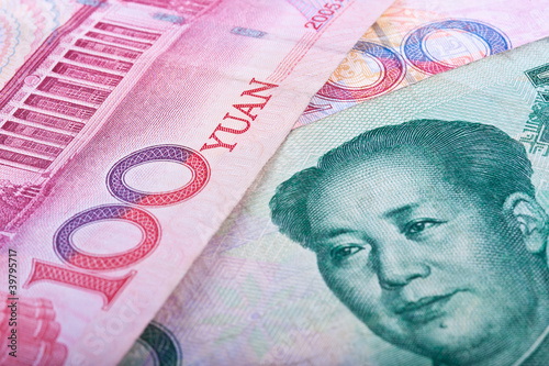 Cropped close-up of Chinese RMB banknotes with limited DOF
