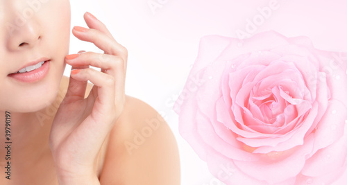 young woman smile mouth with pink rose flower