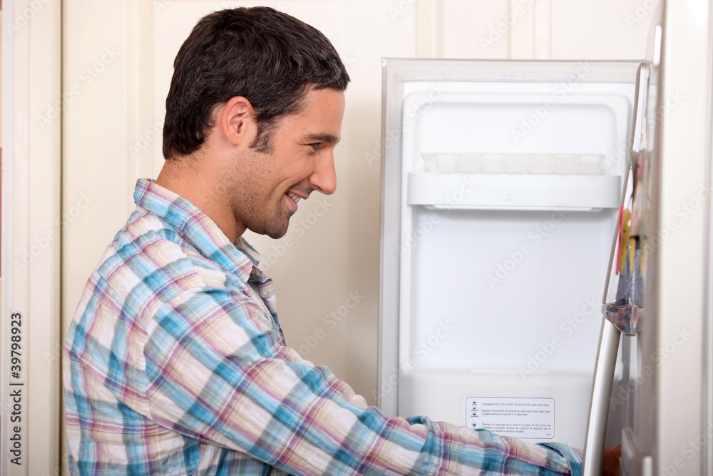 Man opening fridge door Man opening fridge door
