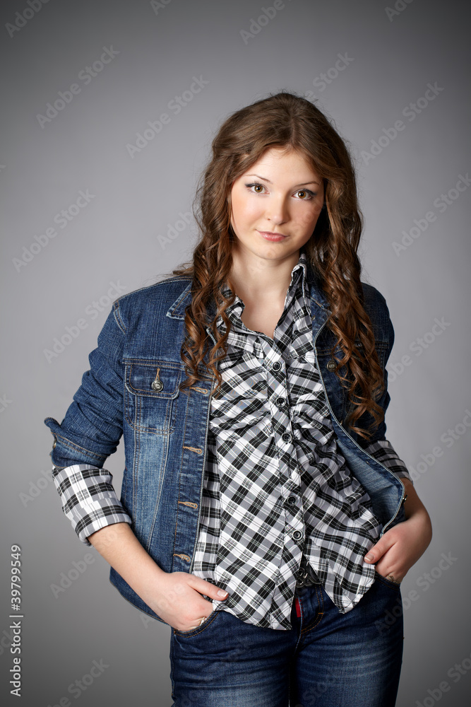 Portrait of an young woman standing and posing in a studio Portrait of an young woman standing and posing in a studio