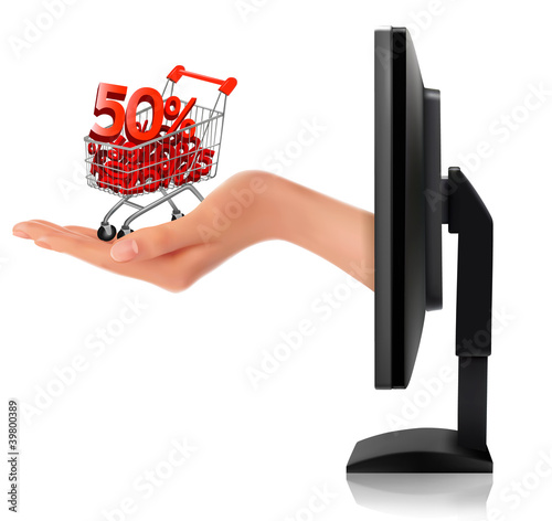 Hand from a monitor with shopping cart full of sales