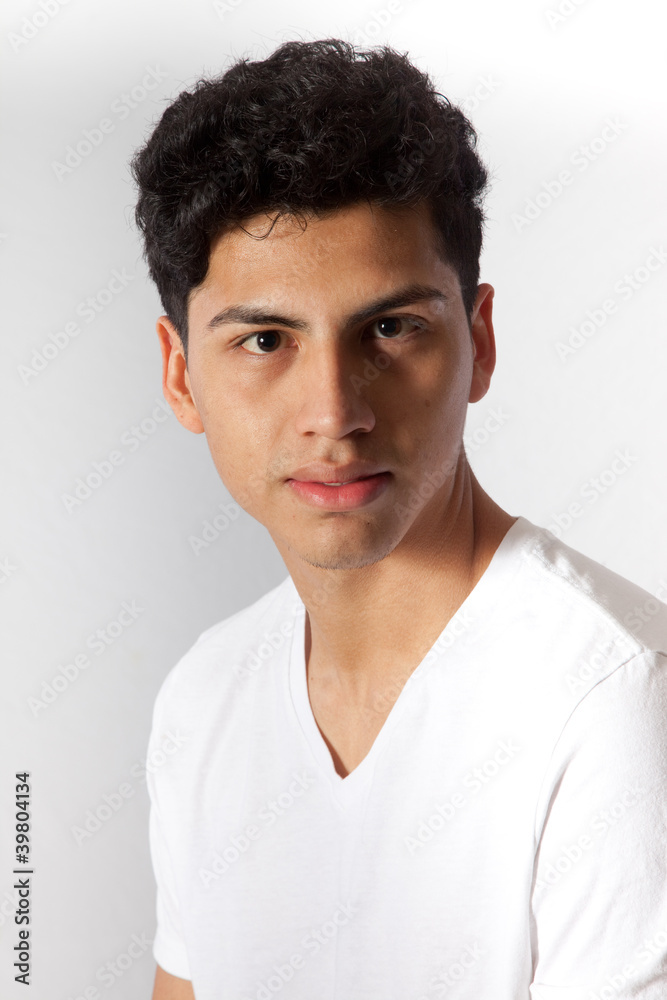 Hispanic man looking thoughtfully at the camera Hispanic man looking thoughtfully at the camera