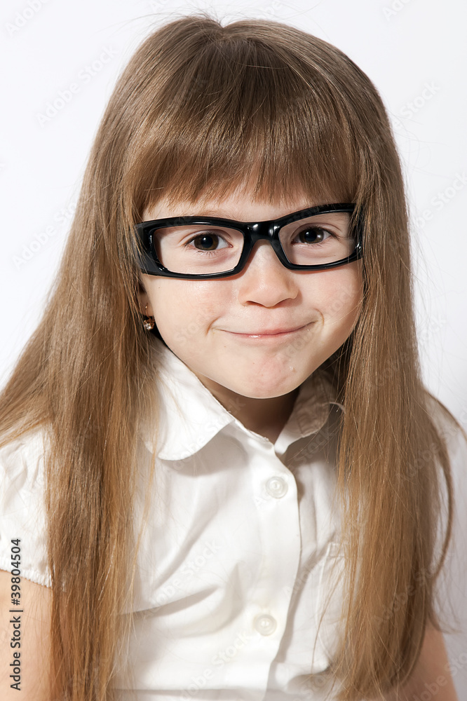 A portrait of the smiling girl wearing glasses A portrait of the smiling girl wearing glasses