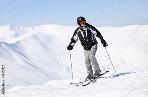 Portrait of skier on mountain slope