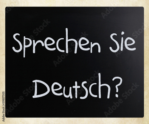 "Sprechen Sie Deutsch?" handwritten with white chalk on a blackb