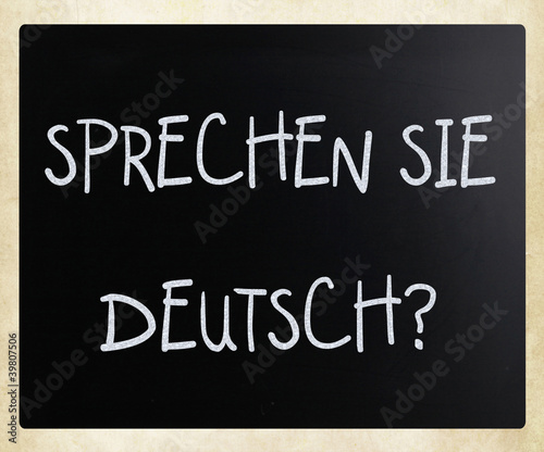  Sprechen Sie Deutsch   handwritten with white chalk on a blackb