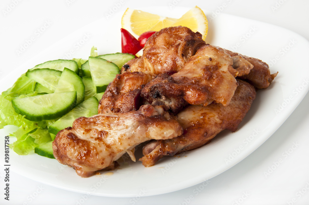 Grilled chicken on a white plate