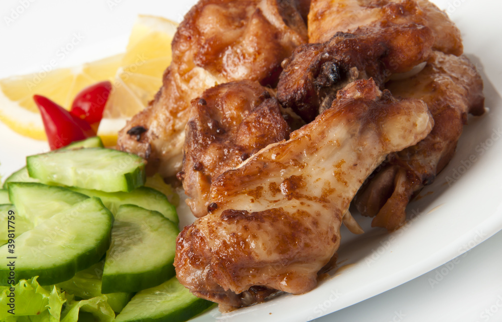 Grilled chicken on a white plate Grilled chicken on a white plate
