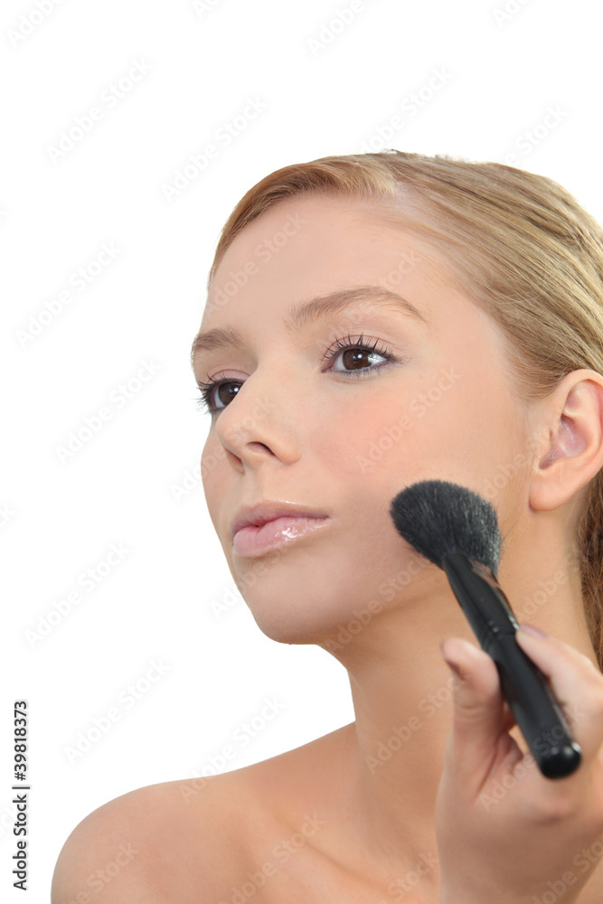 Woman applying makeup Woman applying makeup