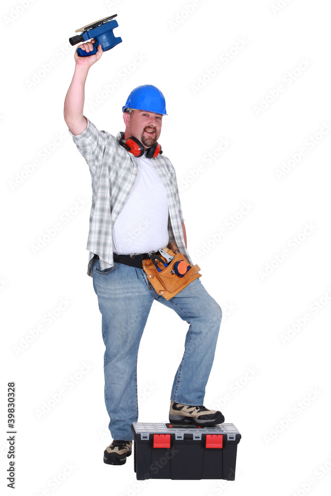 Man using power sander Man using power sander