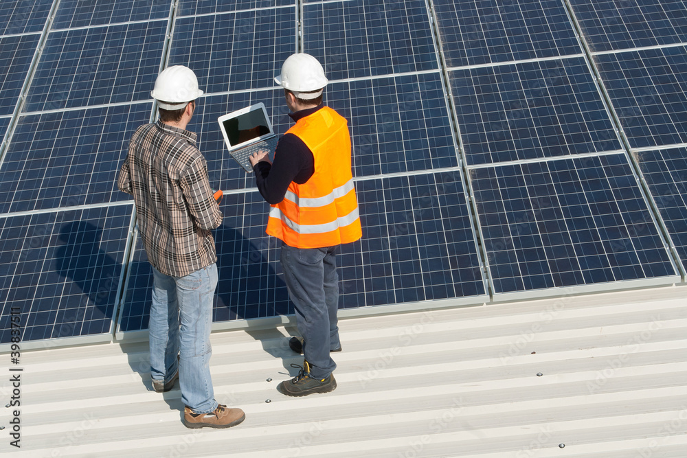 Men working on a photovoltaic plant