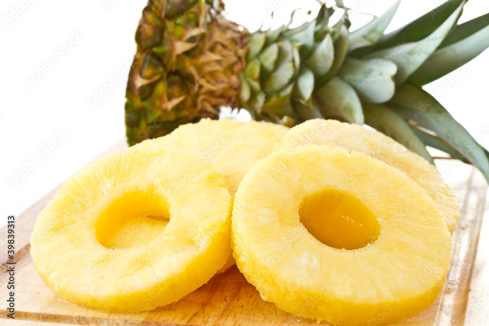 peeled slices of pineapple peeled slices of pineapple