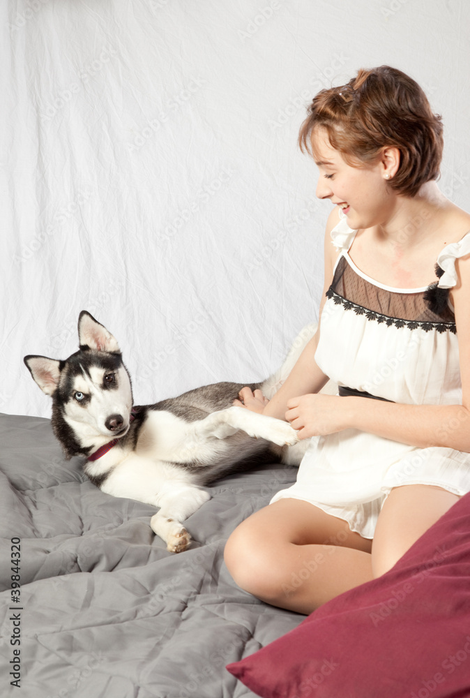 pretty woman with her pet husky dog pretty woman with her pet husky dog