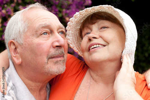 closeup portrait of happy senior couple outdoors