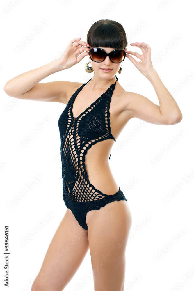 Sexy underwear model posing in a studio in a handmade swimsuit