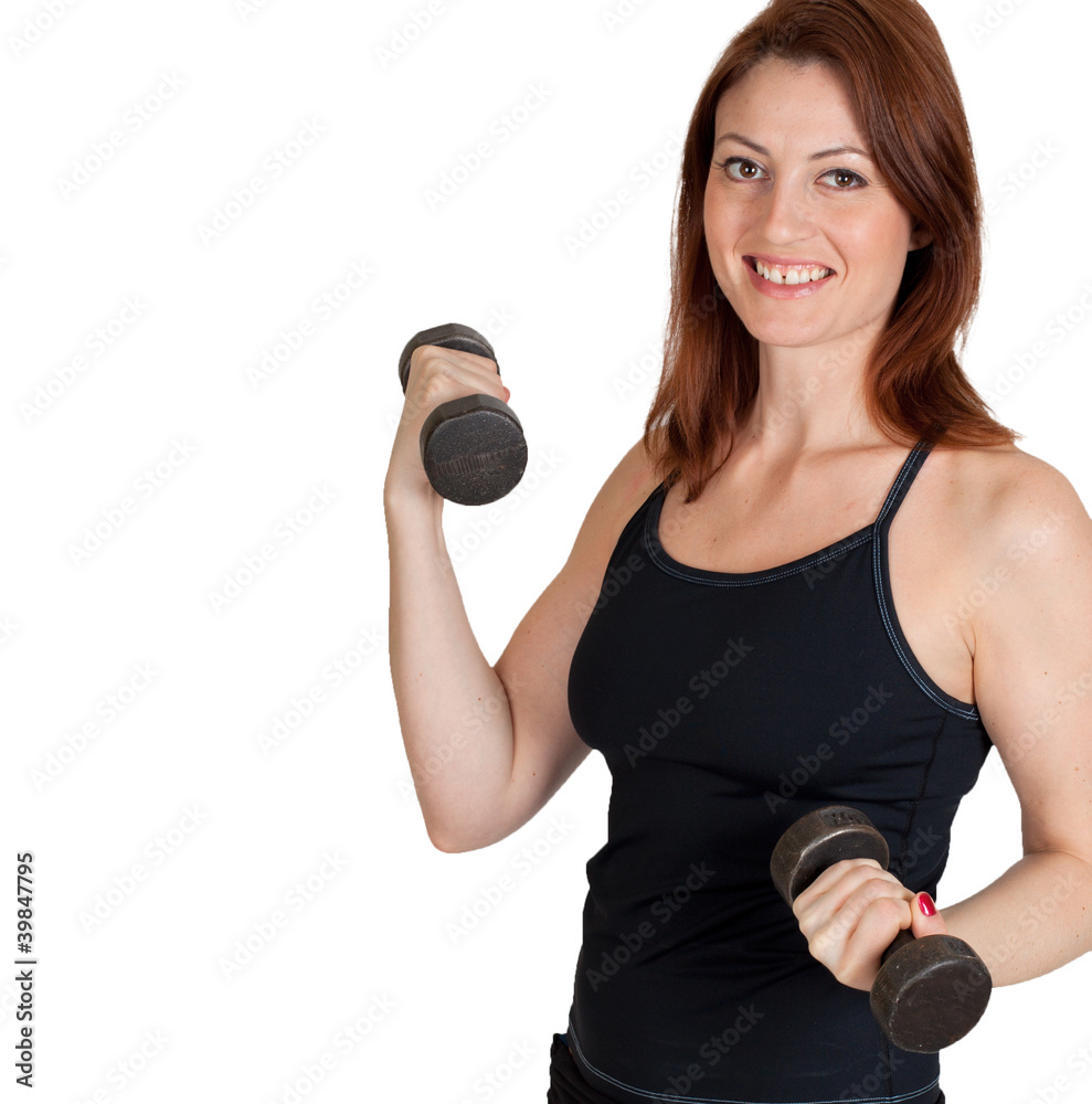 A beautiful woman working out with weights