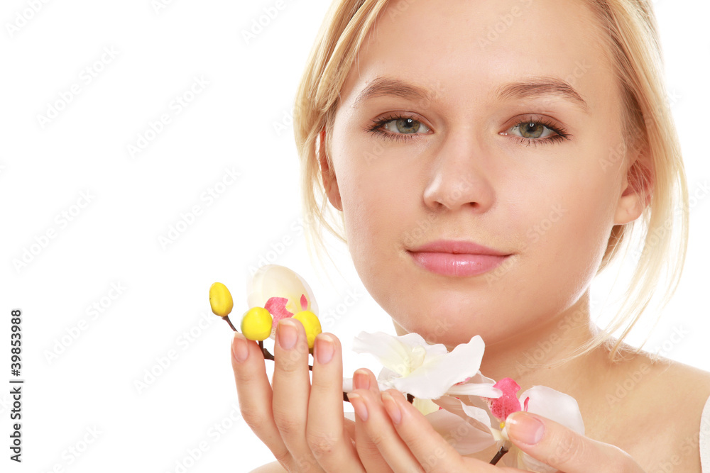 Closeup of a beautiful woman holding a flower Closeup of a beautiful woman holding a flower