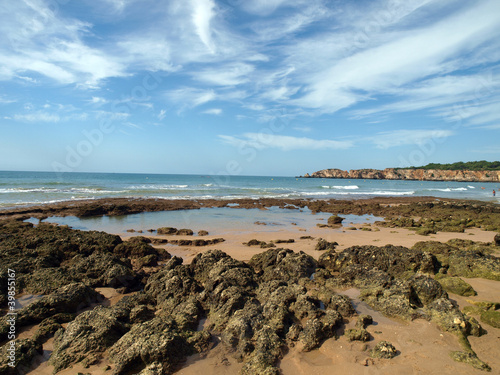 Algarve coast at low tide the ocean . photo